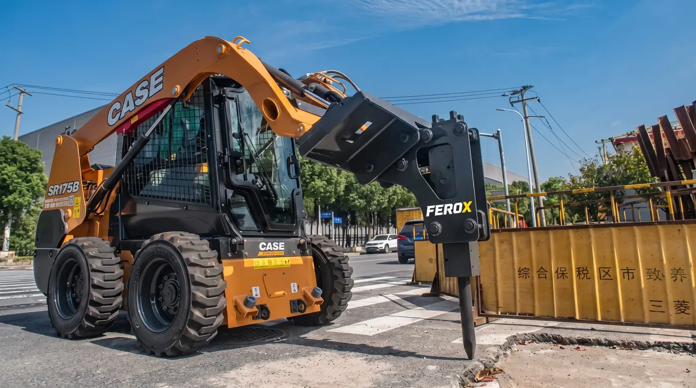 Hydraulic breaker breaking reinforced concrete with an excavator
