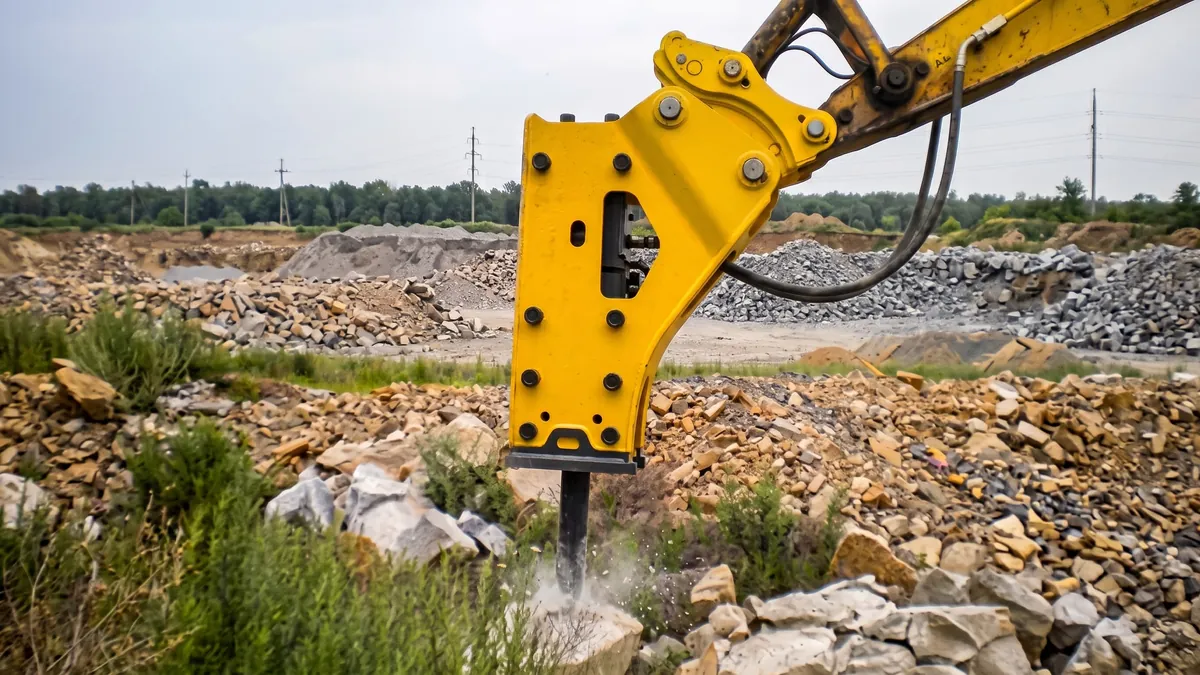 Quick coupler connecting a hydraulic breaker to an excavator arm